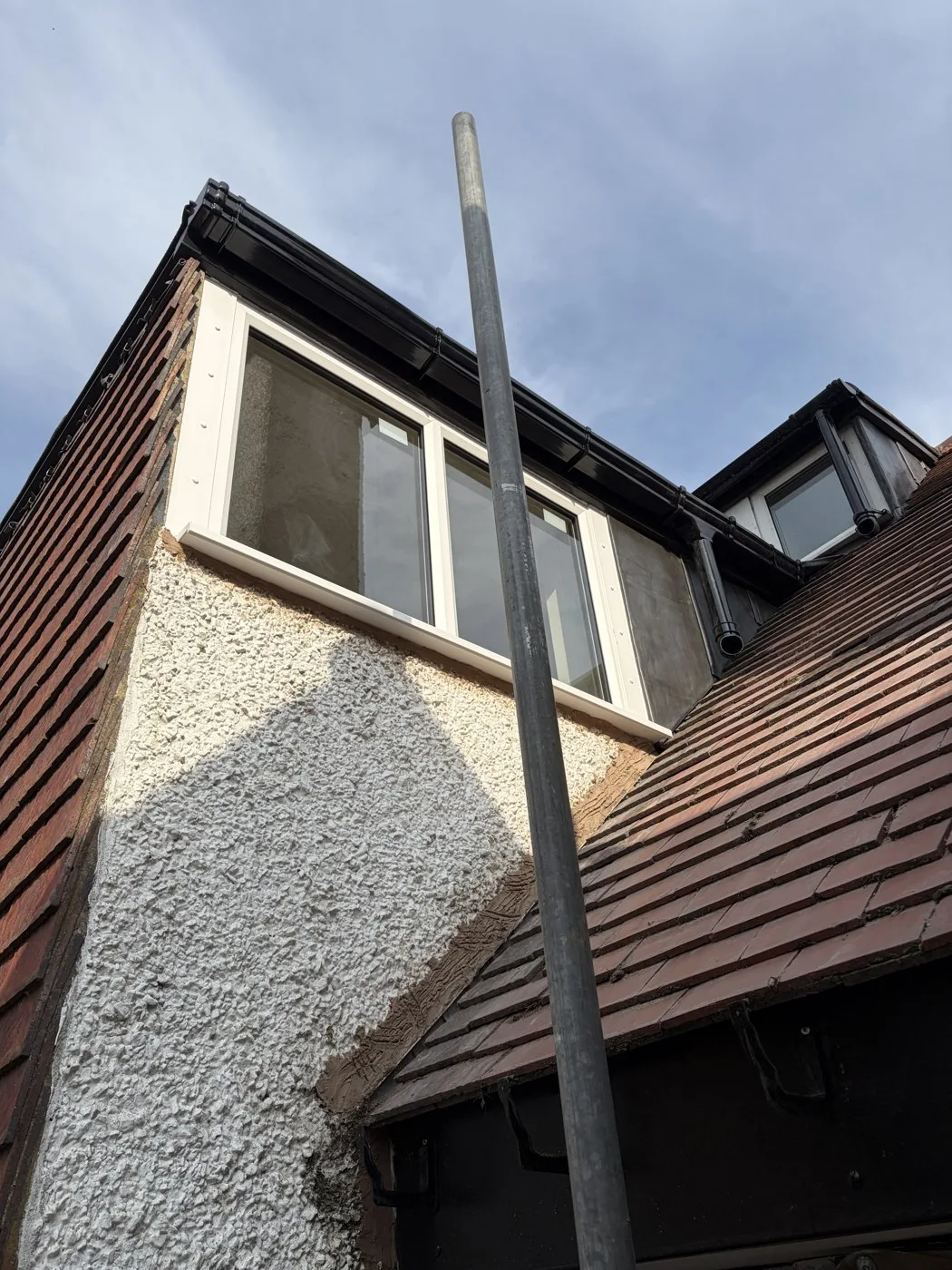 Renewed lead covering on the dormer cheeks with black guttering at the Ormskirk property