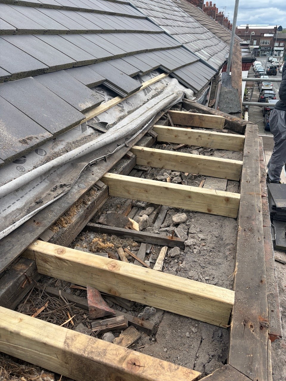 New timber joists during structural repairs to a bay window flat roof in Fazakerley, Liverpool