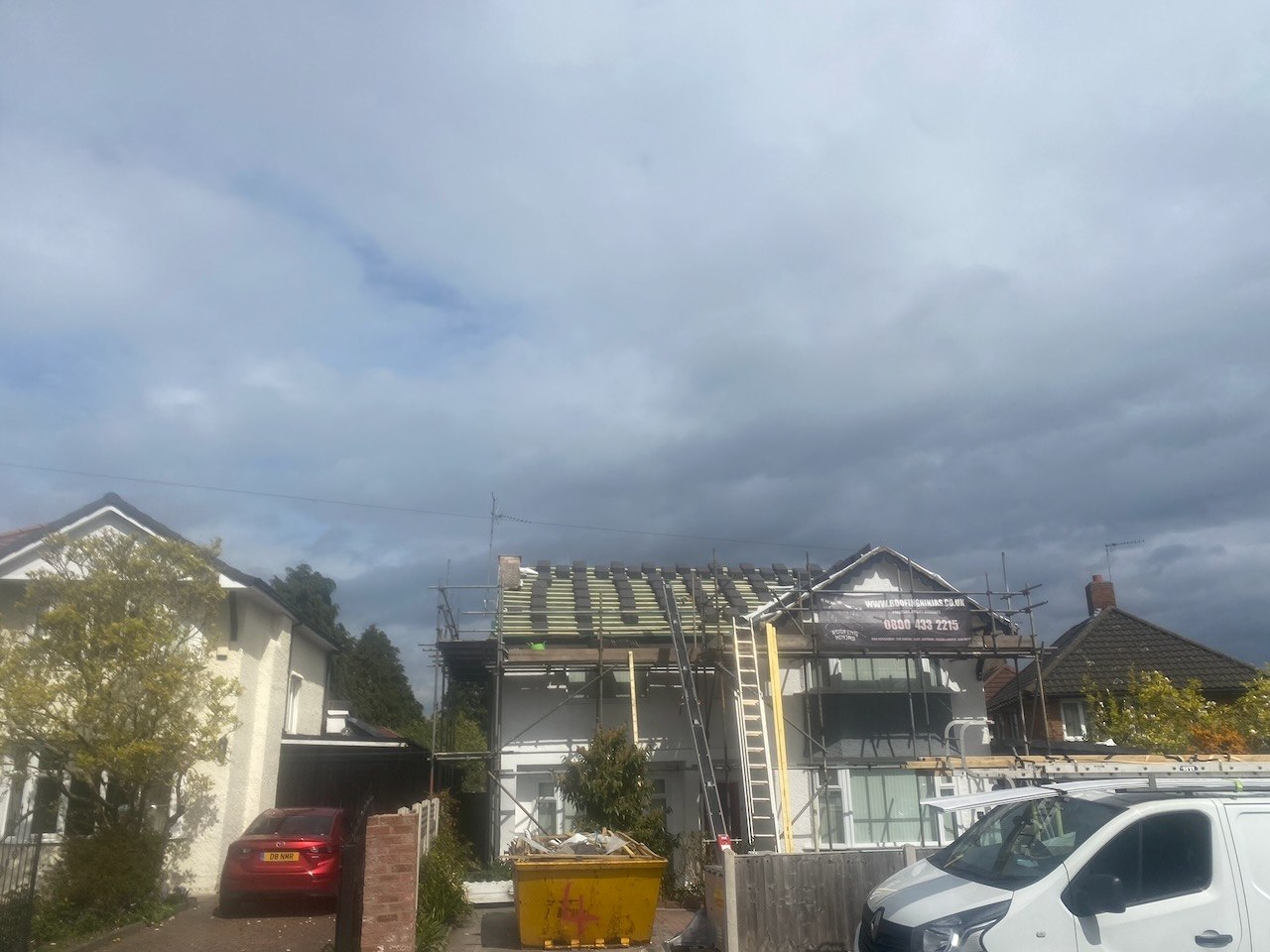 Stripping the main roof at the Upton property