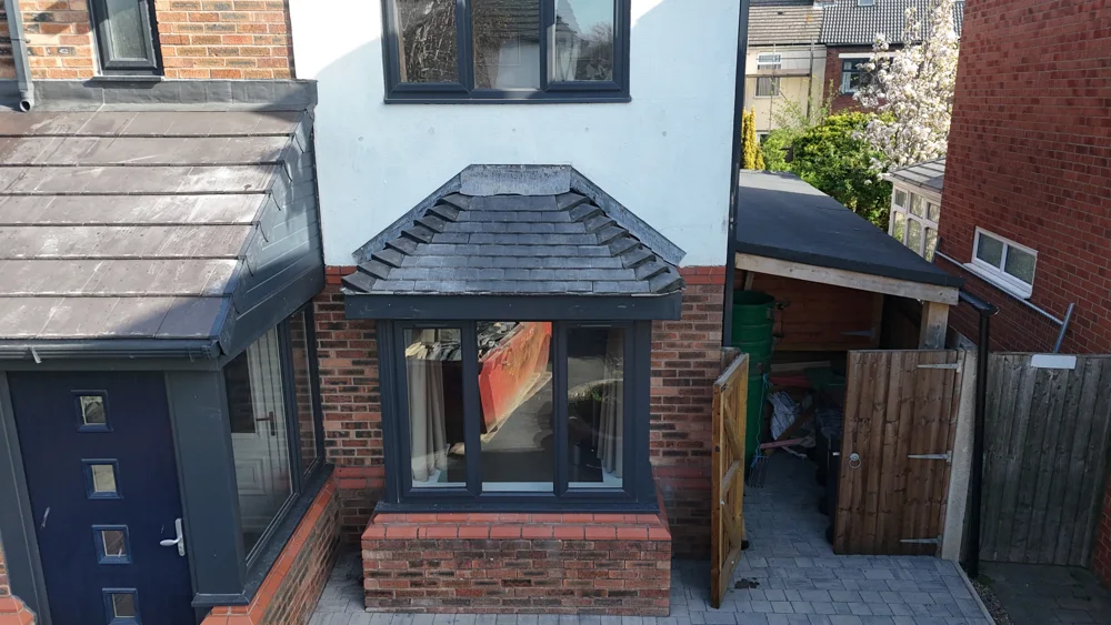 Tiled porch roof above a house entrance