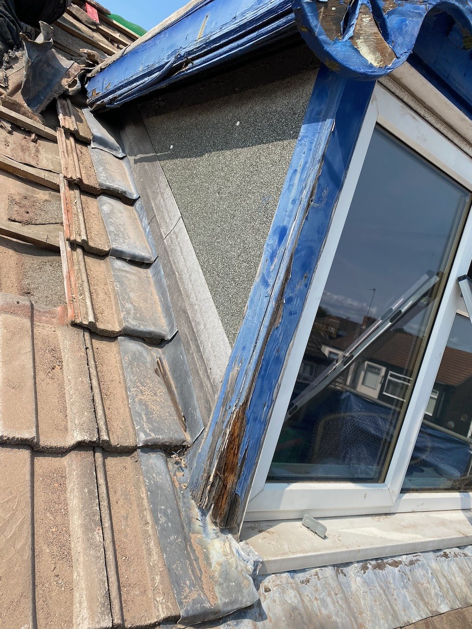 Earlier condition of the blue decorative dormer during the Wallasey roof replacement